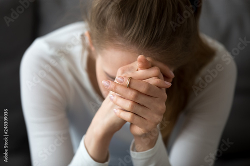 Sad woman feeling hopeless crying alone, girl in despair concept