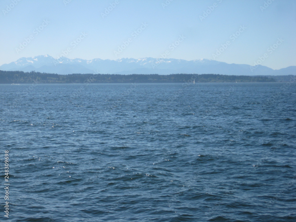 Sea and landscape with snowy mountains