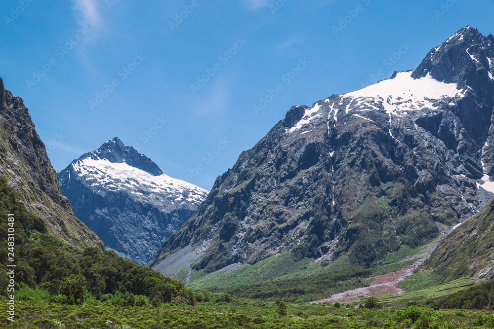 Huge mountains with snow in Fjordland National park in New Zealand Huge mountains with snow in Fjordland National park in New Zealand