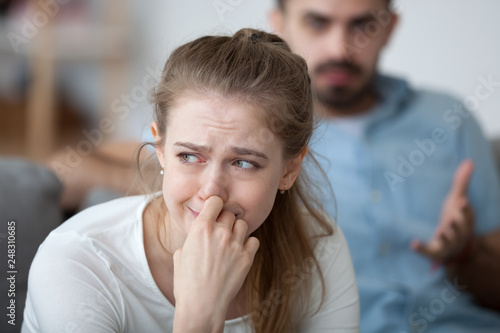 Konstfotografi Stressed woman crying feeling depressed offended by controlling husband tyrant