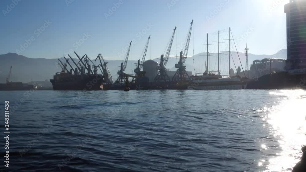 Cargo ship-lifting cranes in the harbor Cargo ship-lifting cranes in the harbor