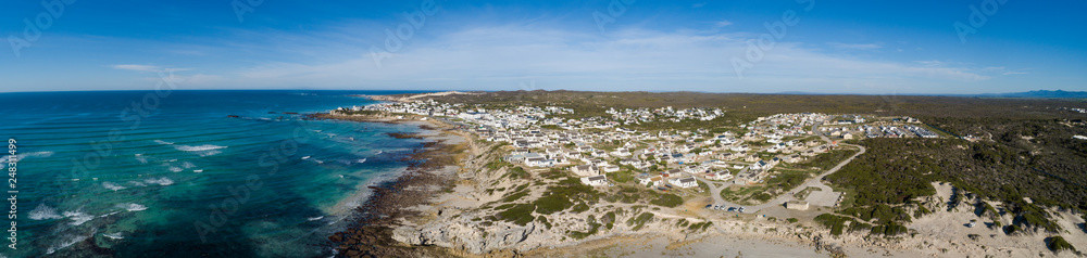 Wide angle landscape image of the dramatic sandstone rock formations along the coastline of Arniston in th Western Cape of South Africa. Wide angle landscape image of the dramatic sandstone rock formations along the coastline of Arniston in th Western Cape of South Africa.