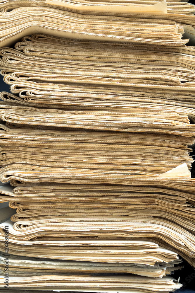 Fototapeta premium A stack of old newspapers for recycling