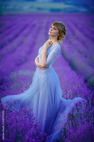 Beautiful Bride in wedding day in lavender field. Newlywed woman in lavender flowers.