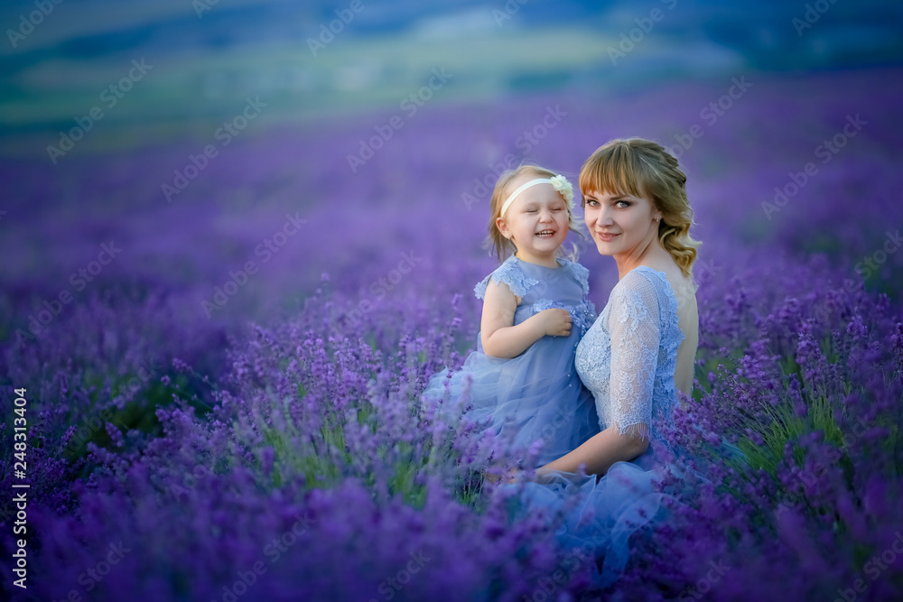Cute baby in the flowering field of lavender. Cute baby in the flowering field of lavender.