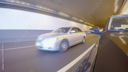 Time lapse of car moves along the city street on sunny summer day. Front view from the car body.