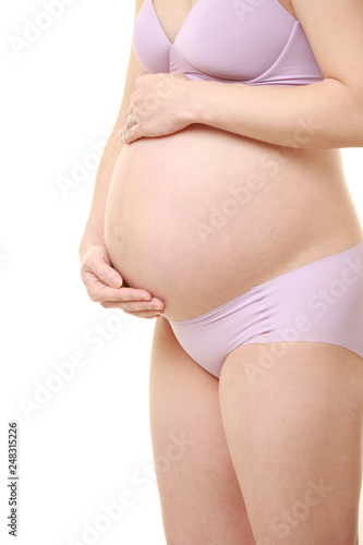 Wallpaper Mural お腹を触る薄紫色の下着を着た臨月の妊婦 Torontodigital.ca