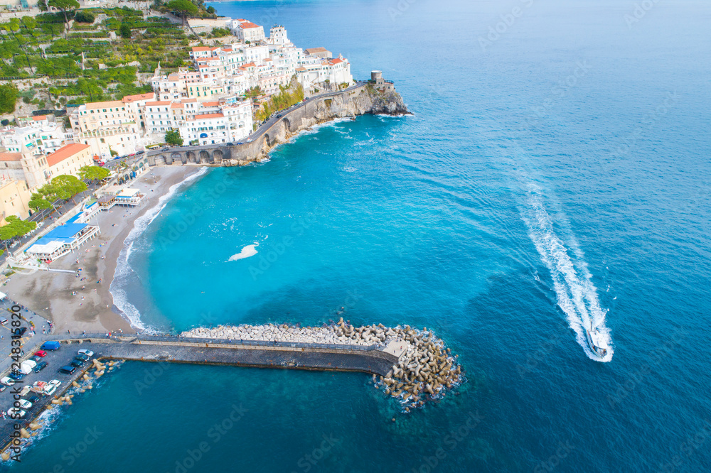 drone view to speed boat on Amalfi coast in Italy