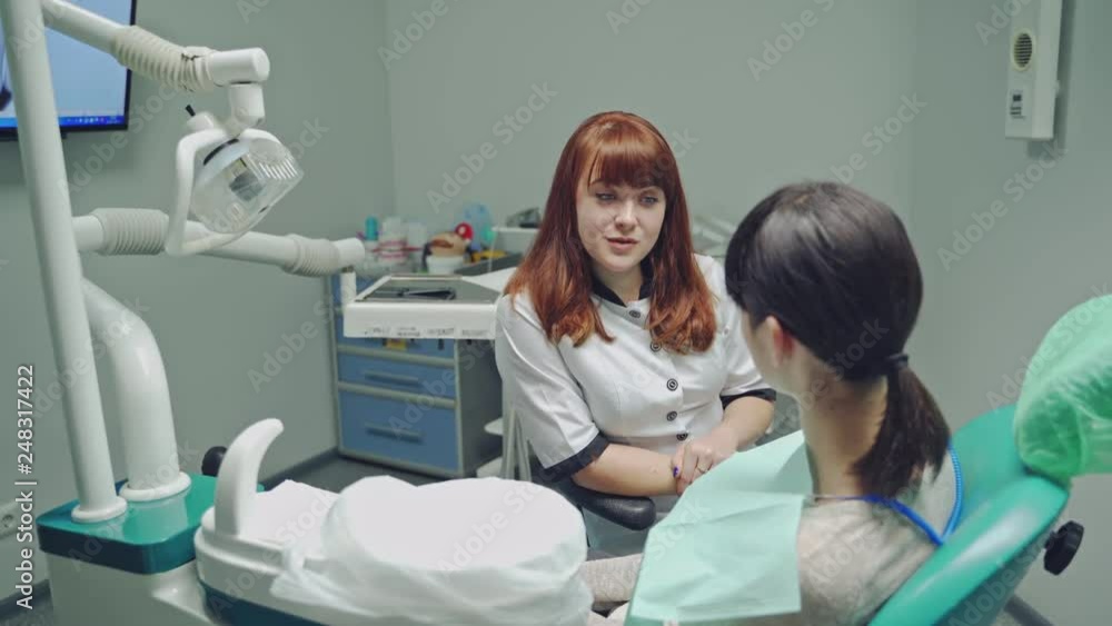 The woman came to see the dentist. Happy patient and dentist concept. Teeth care. The woman came to see the dentist. Happy patient and dentist concept. Teeth care.