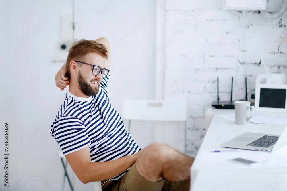 Successful businessman. Office worker. Portrait of bearded businessman. Serious businessman. Man standing at table and holds laptop. Handsome bearded office worker. Successful businessman. Office worker. Portrait of bearded businessman. Serious businessman. Man standing at table and holds laptop. Handsome bearded office worker.