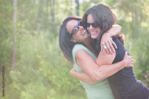 Joyful Mother and Daughter Hugging photo