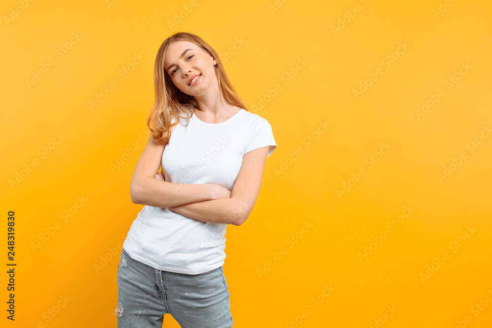 Portrait of a pensive girl, dreamy girl looks away, on yellow background Portrait of a pensive girl, dreamy girl looks away, on yellow background