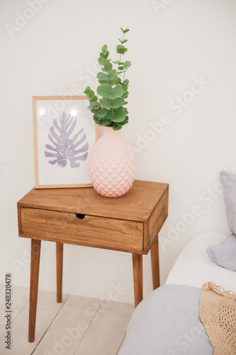 vase on a bedside table in an interior