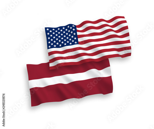 National vector fabric wave flags of Latvia and America isolated on white background. 1 to 2 proportion.
