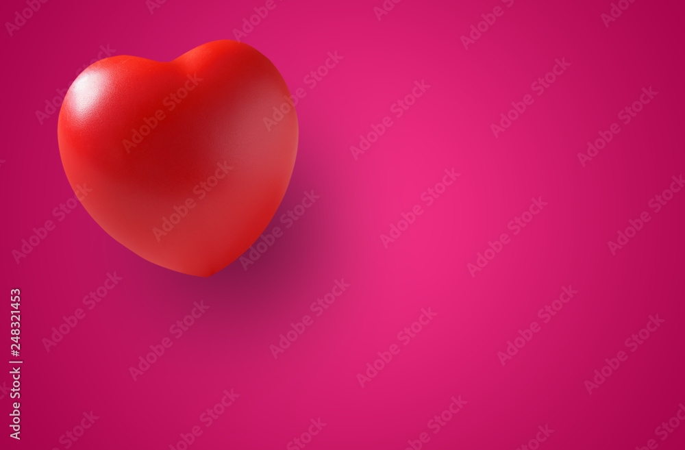red heart rubber with shadow for love memorial or romantic on valentine day with wedding card and heart health on board or table with pink paper or space and background