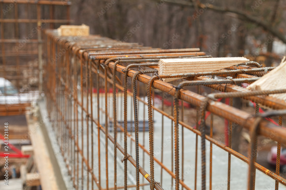 Construction of a new building, binding of reinforcement Stock Photo ...