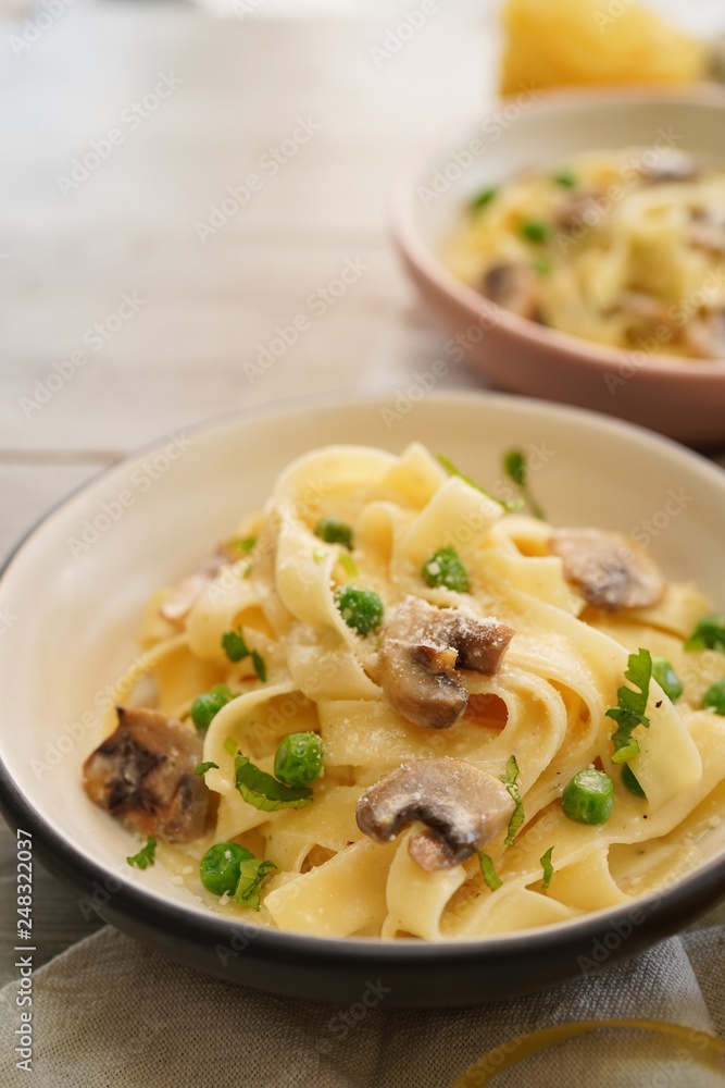 Homemade Fettuccine Alfredo with mushrooms and green peas Homemade Fettuccine Alfredo with mushrooms and green peas