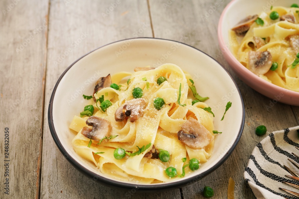Homemade Fettuccine Alfredo with mushrooms and green peas