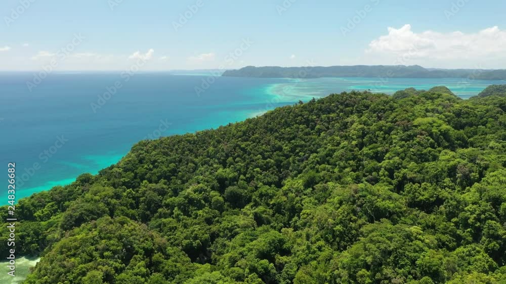 Aerial view of Koror island area, lush green islands and blue lagoons with colorful coral reefs, azure crystal clear water of western Pacific Ocean - landscape panorama of Micronesia from above, Palau Aerial view of Koror island area, lush green islands and blue lagoons with colorful coral reefs, azure crystal clear water of western Pacific Ocean - landscape panorama of Micronesia from above, Palau