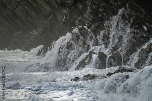 Sea waves breaking in the coast cliffs in Barrika