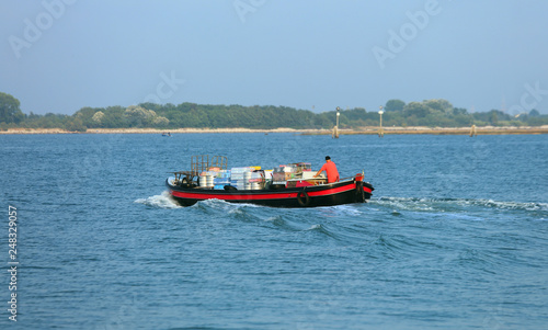 boat for transporting goods in the Venice lagoon on the Adriatic © ChiccoDodiFC