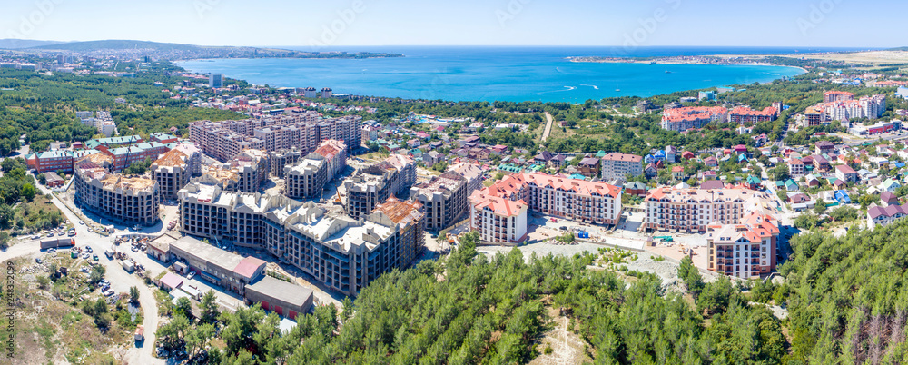 Construction of residential high-rise buildings in Gelendzhik on the shore of Gelendzhik Bay. At the foot of the Caucasus mountains on the Black sea in the resort town of Gelendzhik is the constructio
