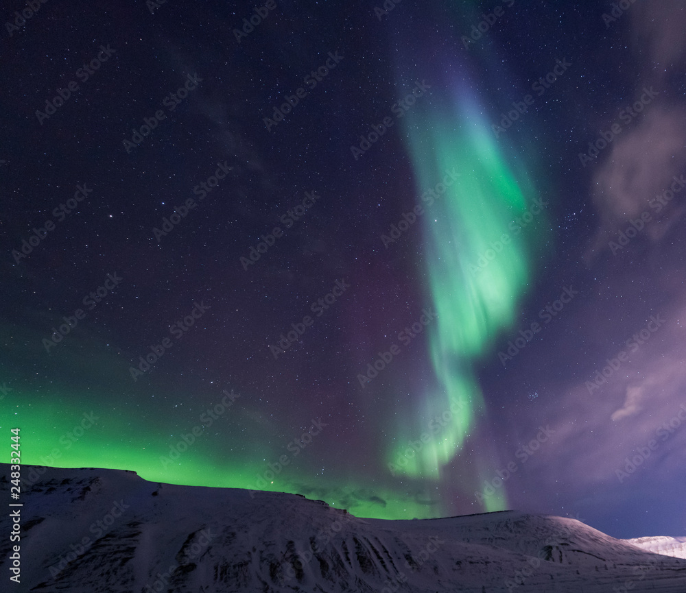 The polar arctic Northern lights aurora borealis sky star in Norway travel Svalbard in Longyearbyen city the moon mountains