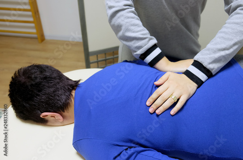 Physical therapist produces a manual effect on the client