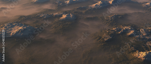 Mountains with snow summits in morning mist.