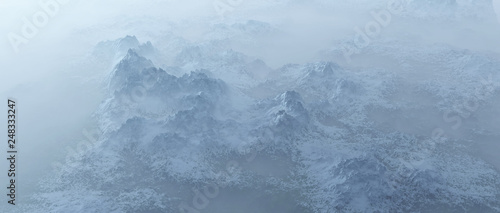 Aerial of rough steep snowy mountains in fog.