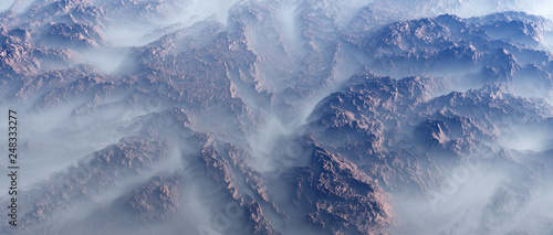 Canvas Print Aerial of rough rock formations in fog.