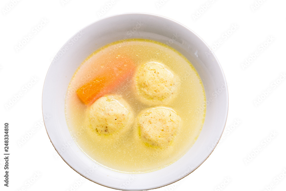 Flat lay isolated traditional matzah ball (kneidlach) soup.White bowl with authentic matzo ball chicken taste hot soup ( bouillon ) isolated on white background. Jewish food for Passover and every day Flat lay isolated traditional matzah ball (kneidlach) soup.White bowl with authentic matzo ball chicken taste hot soup ( bouillon ) isolated on white background. Jewish food for Passover and every day