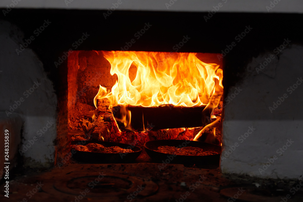 Cooking in the Russian stove. Tasty pancakes in Russia Cooking in the Russian stove. Tasty pancakes in Russia
