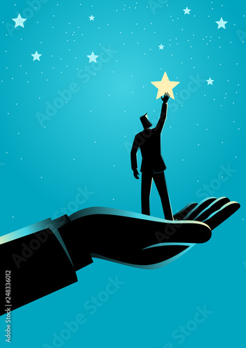 Giant hand helping a businessman to reach out for the stars