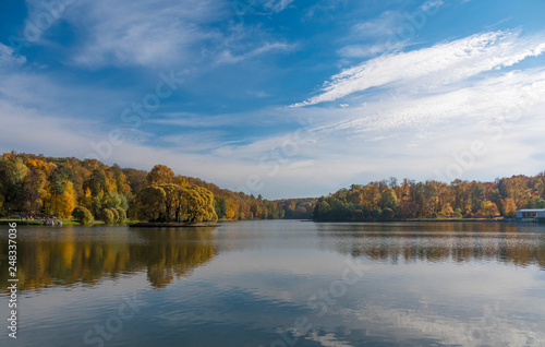 Autumn foliage with water reflection natural landscape © Arrows