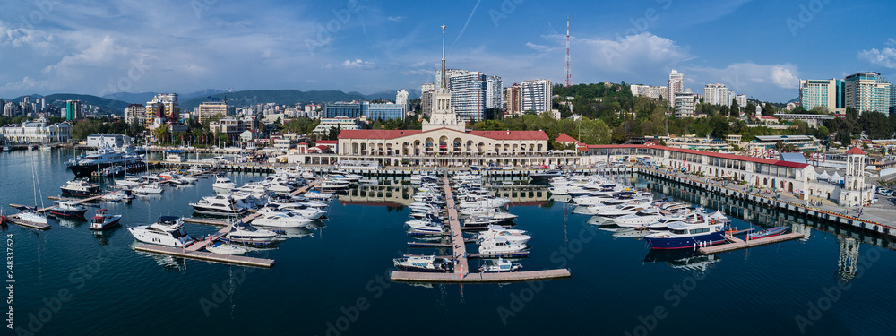 Yachts and boats anchored in the port of Sochi at sunset. Russia. Aerial view