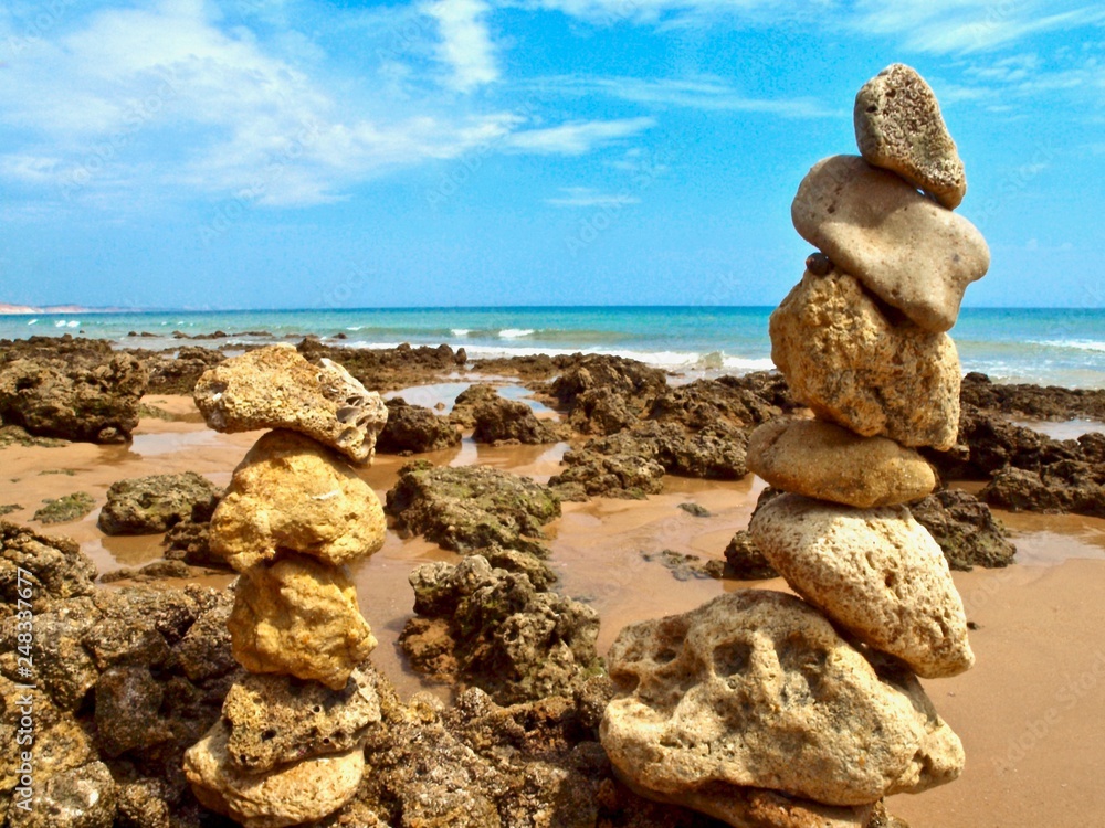 Pebbles pf stones at the beach, symbol for inner life balance in Zen meditation