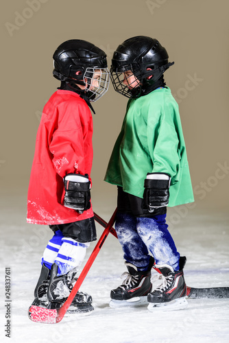 Photography Two ice hockey players in uniform facing off. Ice hockey.