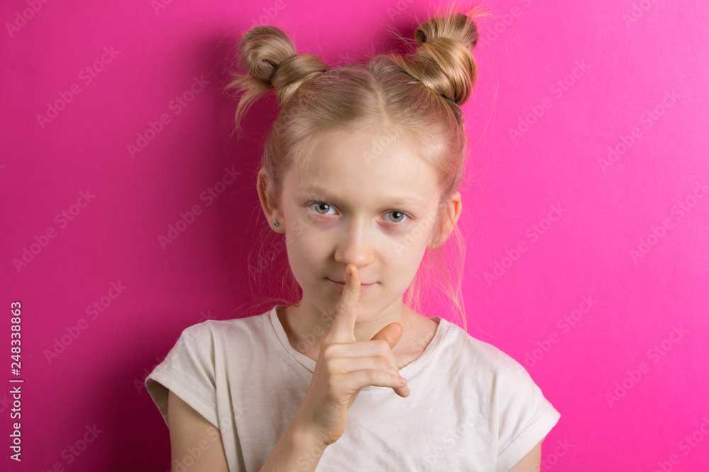 Fototapeta premium little girl blonde on a pink background