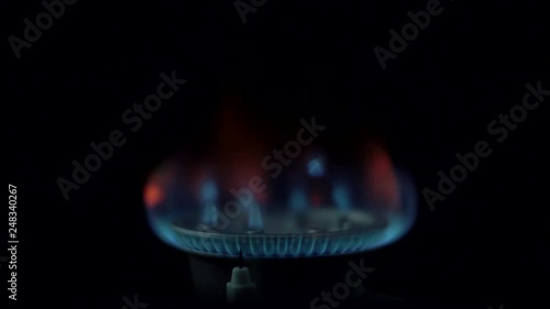 The gas burner ignites and the fuel burns photo