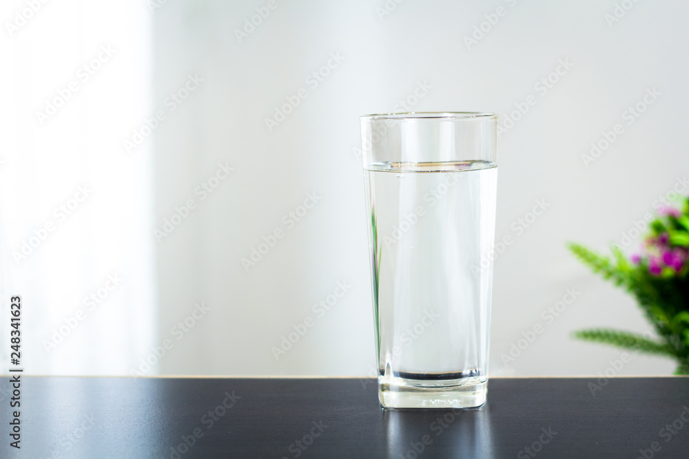 Glass of water on the table background Glass of water on the table background