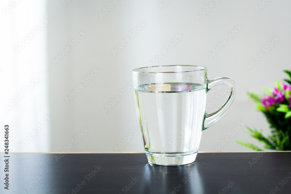 Glass of water on the table background Glass of water on the table background