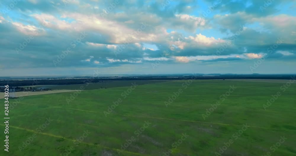 Green field, rural plant. Ukraine, Rivne region, Aerial drone view Green field, rural plant. Ukraine, Rivne region, Aerial drone view
