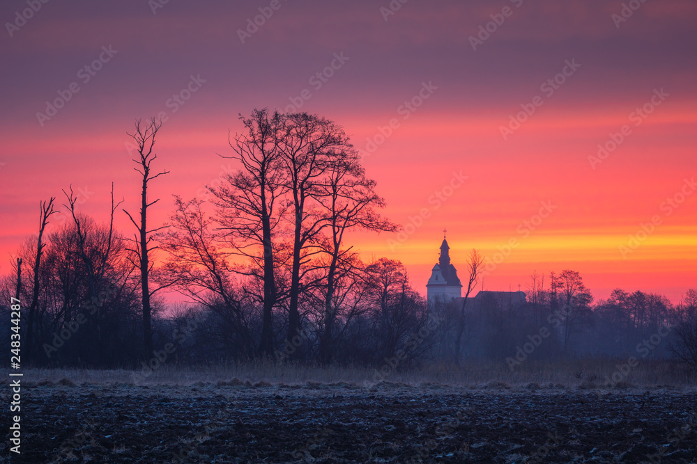 Dawn over the church in Jazgarzew near Piaseczno, Poland Dawn over the church in Jazgarzew near Piaseczno, Poland