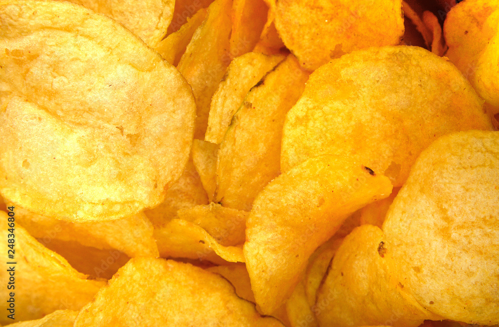 Heap of Crispy Potato Corrugated Chips. Food. Fatty Unhealthy Fast Food