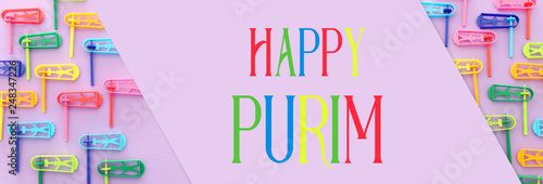 top view image of Purim celebration concept  jewish carnival holiday  over purple background. Top view  flat lay.