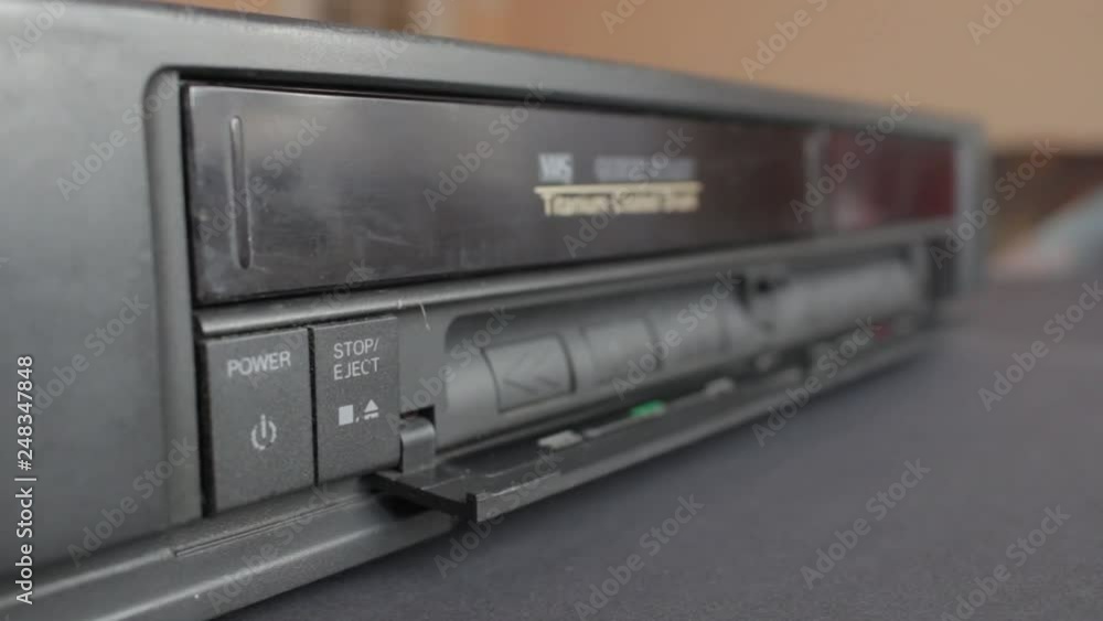 Removing a VHS Tape from a VCR Player. Sound included. Flat Picture Profile Removing a VHS Tape from a VCR Player. Sound included. Flat Picture Profile