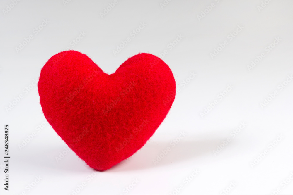 Red heart shaped fabric on white background