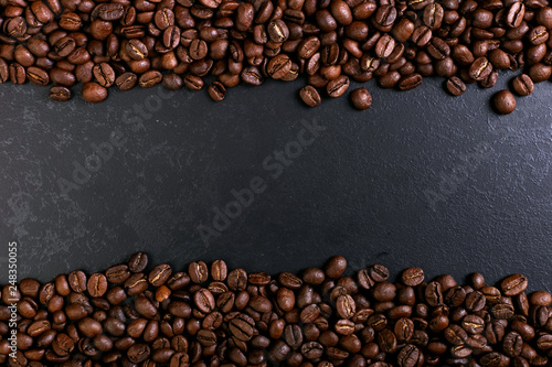 Fragrant coffee beans on rustic tabletop background. Banner copy space. © Plutmaverick