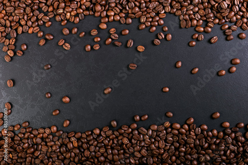 Aroma roasted coffee beans on rustic tabletop  brown banner background.
